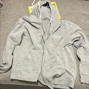 Gray zip up hoodie.
